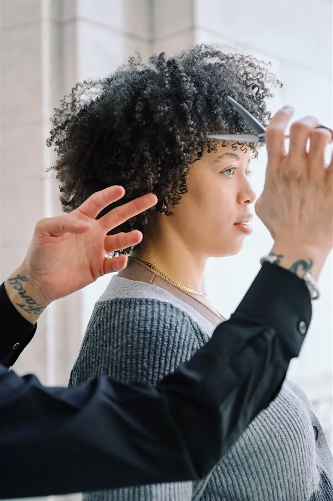 Steven, owner of Steven Serrato, cuts curly hair for a fresh look